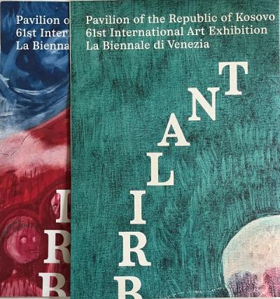 Partial view of two folded exhibition posters, one on top of the other. Top poster has a green background with a skull, the other a red mountain with blurry faces. Text in white letters runs on the top and in a diagonal across the page.