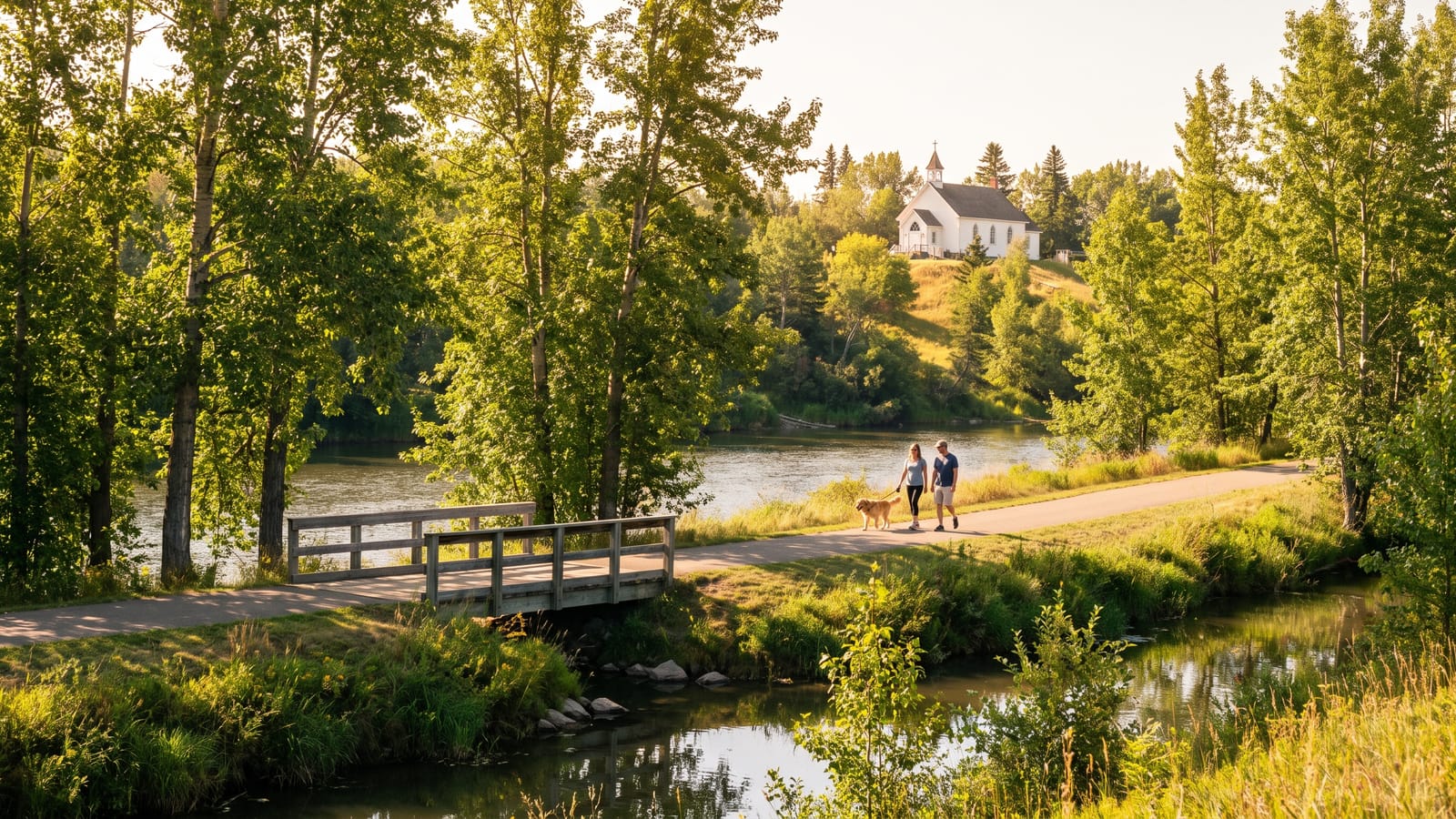 A riverside trail with the historic mission church on the hill, typical of St. Albert