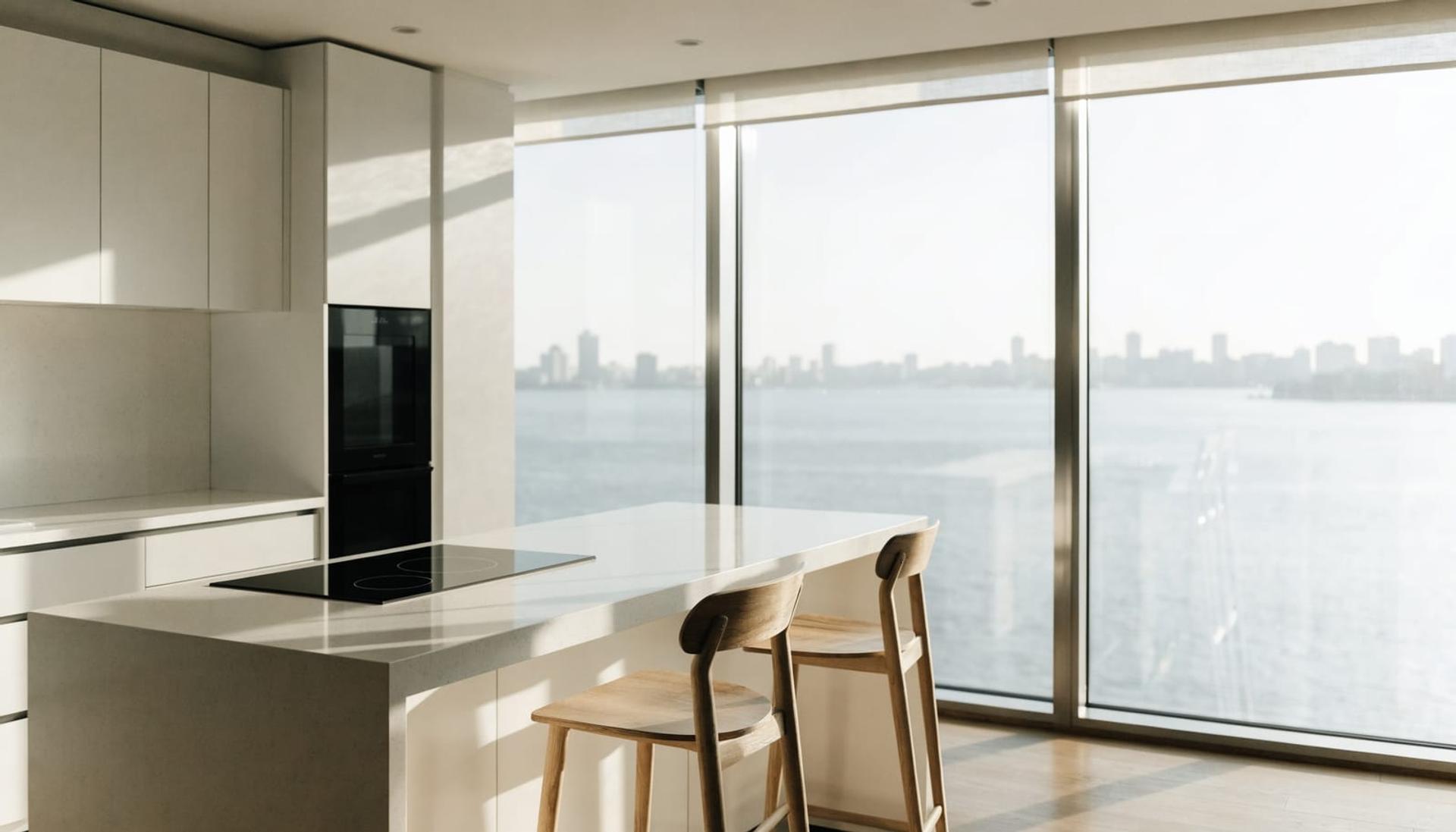 A clean, modern kitchen with a city view