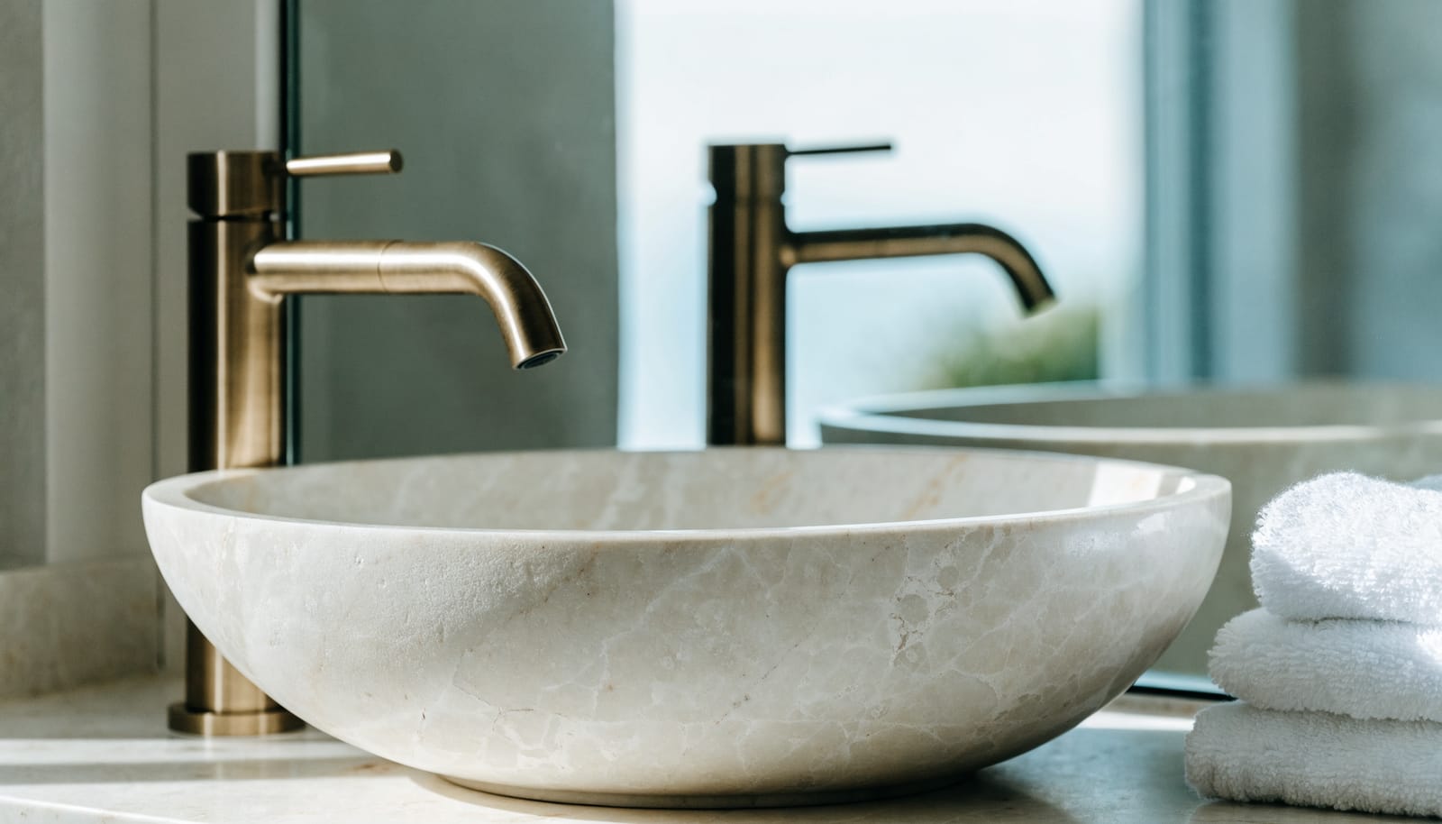 A gleaming bathroom basin and fixtures