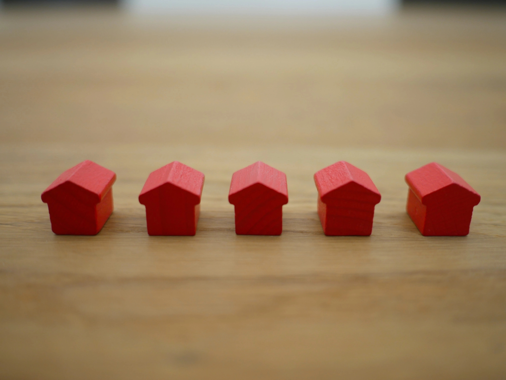 Red toy houses in a row