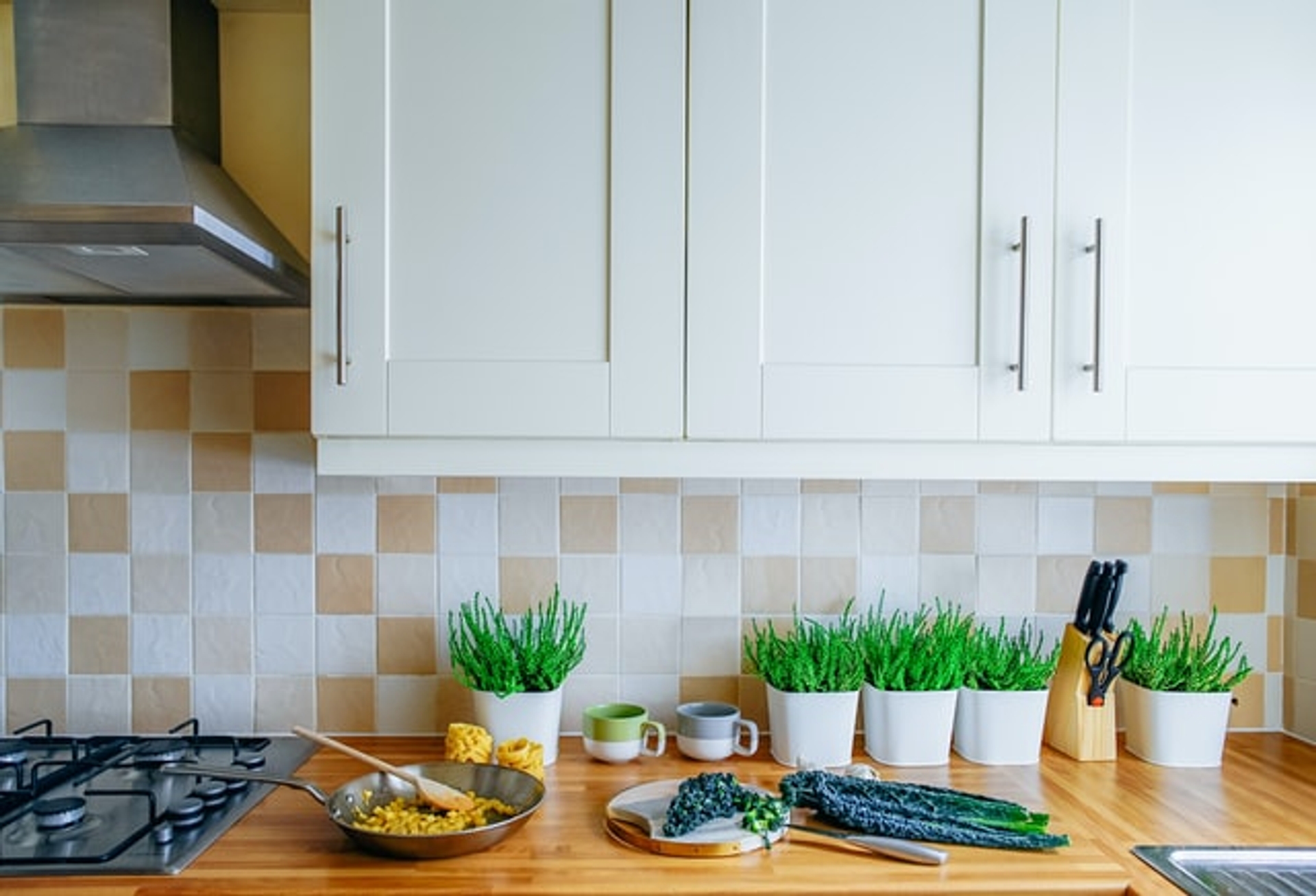 A kitchen with some freshly cooked food sat on the countertop