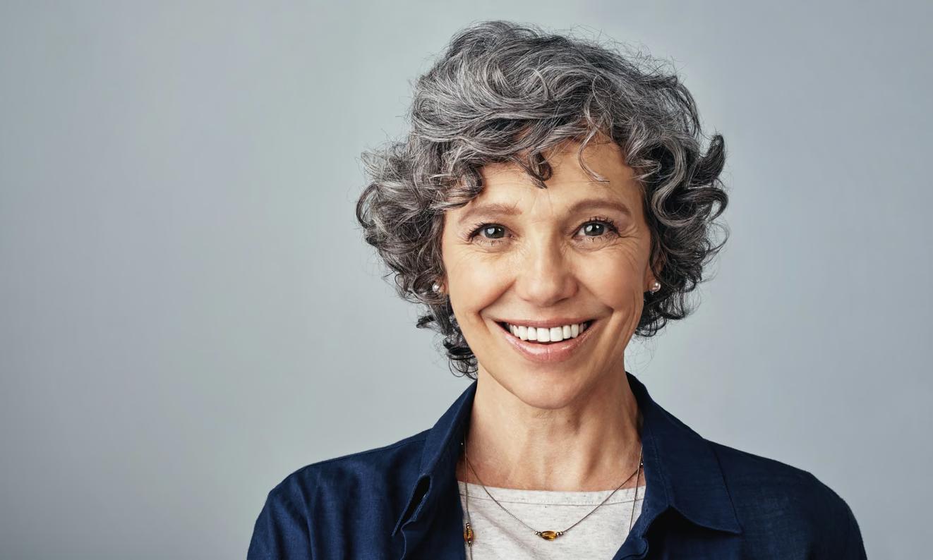 Smiling mature woman with a confident, natural-looking smile