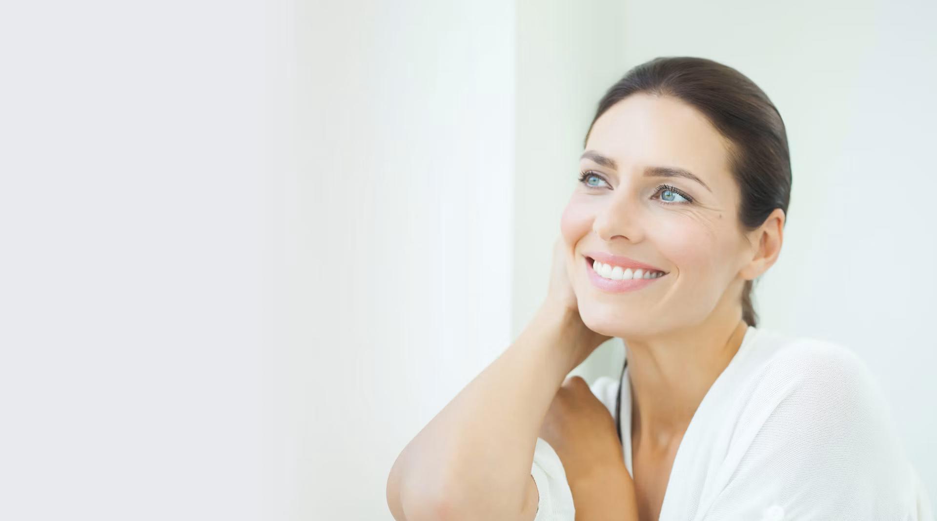woman with dental implants smiling