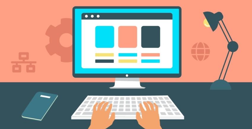 hands on keyboard and screen in background