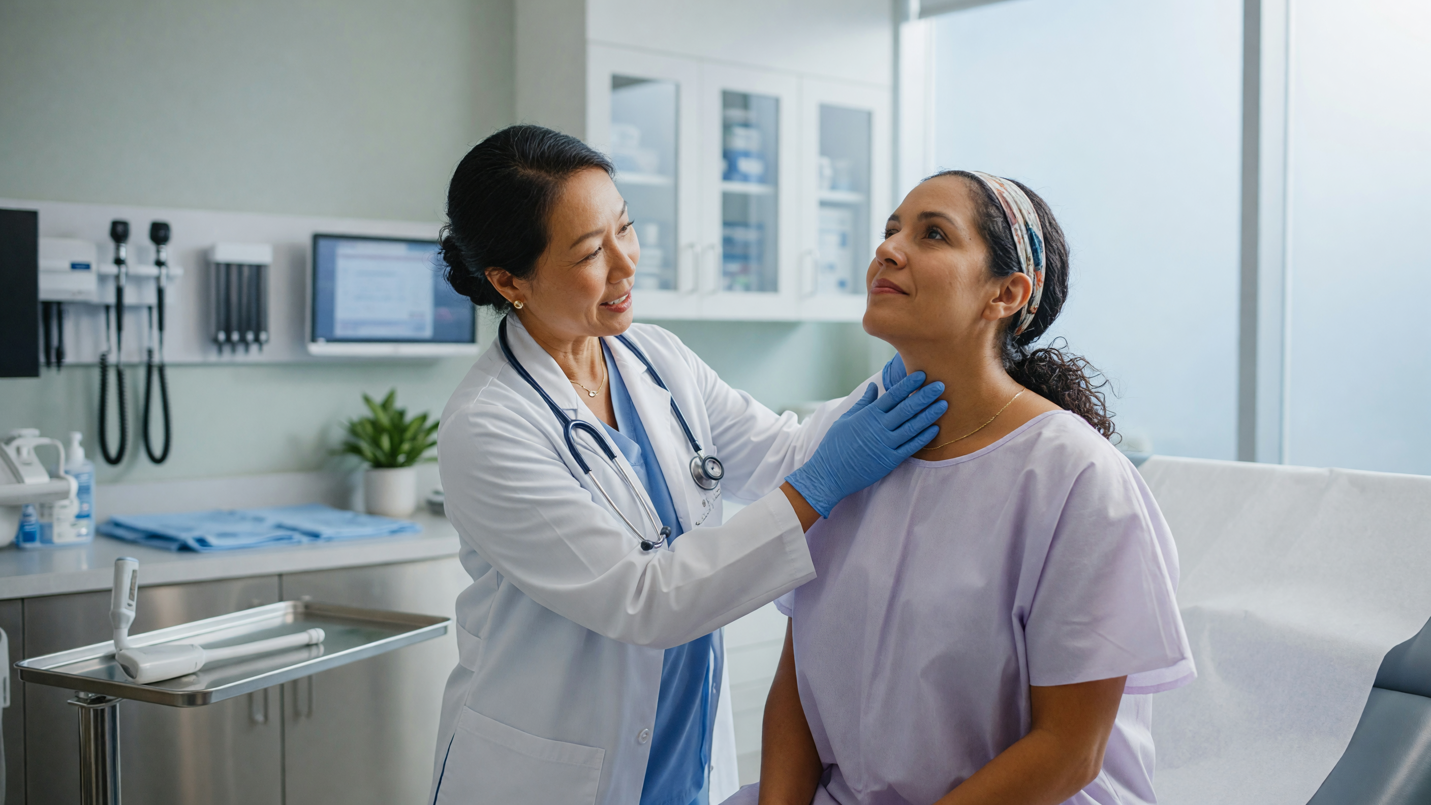 Doctor examining patient's neck for thyroid swelling treatment evaluation