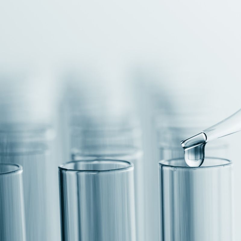 pipette dripping liquid into test tubes