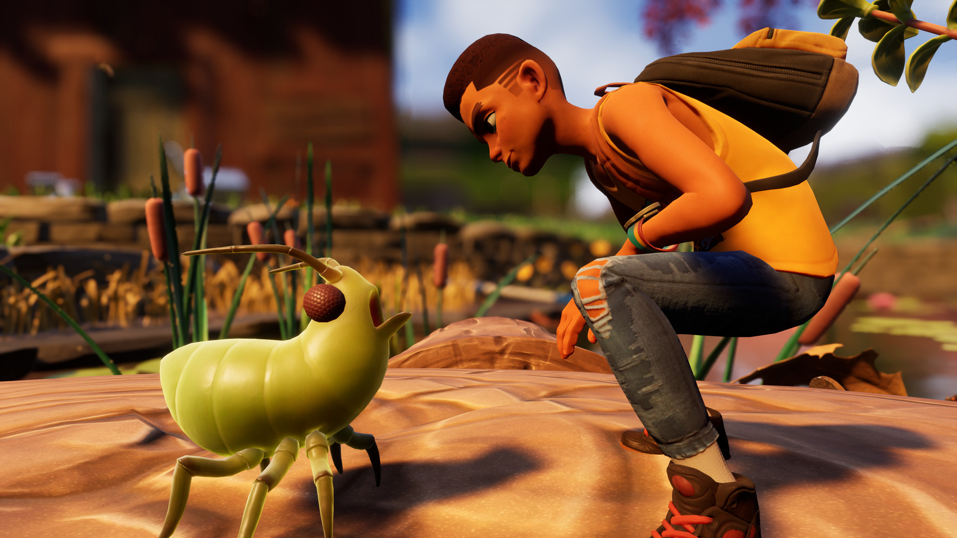 A shrunken teenager crouched beside a green aphid on sand