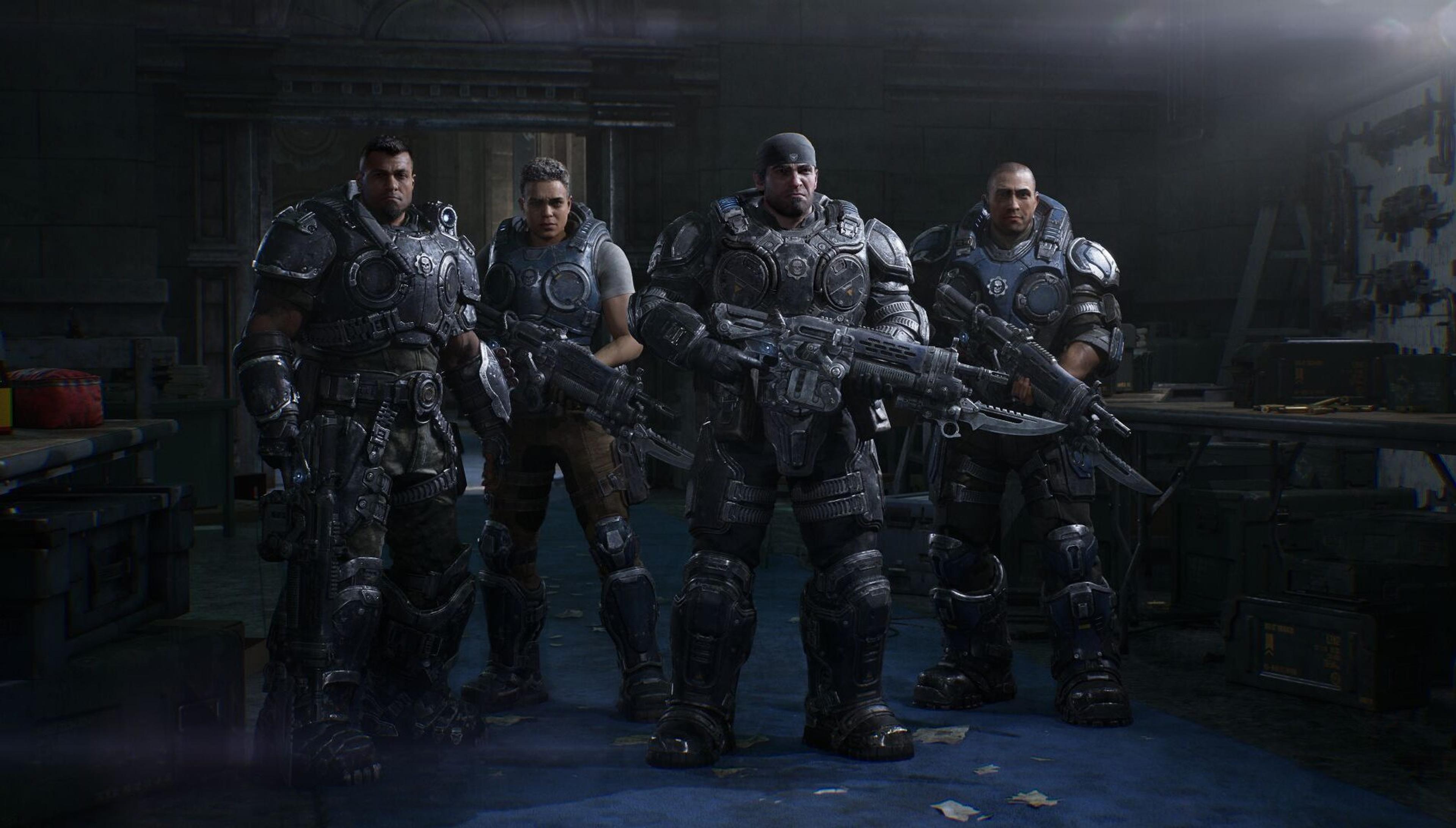 Four COG soldiers including a young Marcus Fenix stand armed in a dim armoury in Gears of War: E-Day. Official screenshot from The Coalition and Xbox Game Studios.
