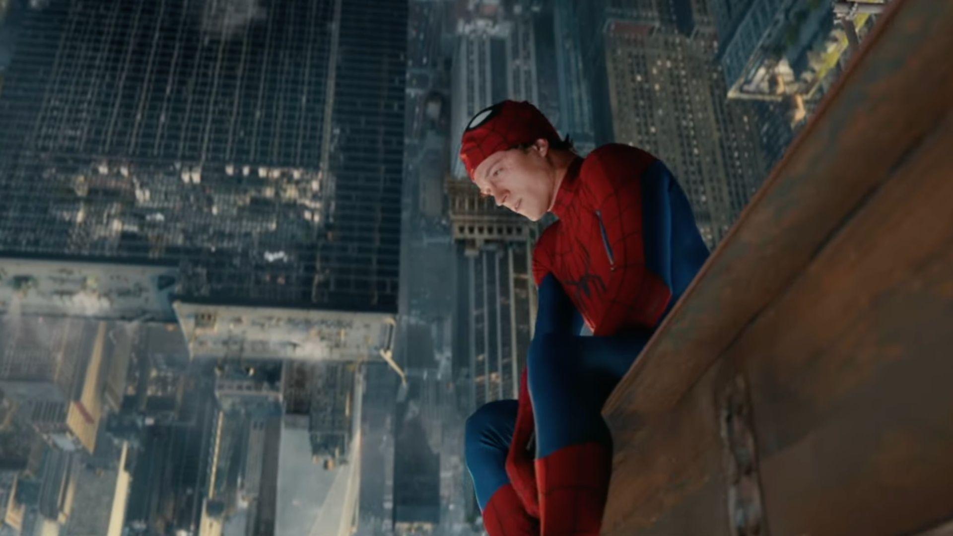 Tom Holland as Spider-Man crouched on a ledge high above the city with his mask pulled up. Still from the Spider-Man: Brand New Day trailer via Sony Pictures.