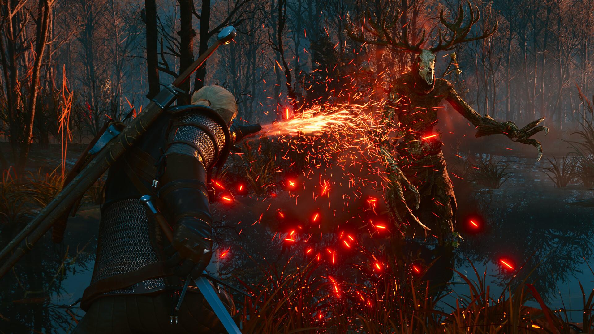 Geralt, seen from behind with two swords on his back, casts a stream of fire from his hand at a leshen, a tall antlered creature with a deer skull for a head, in a swamp at dusk.