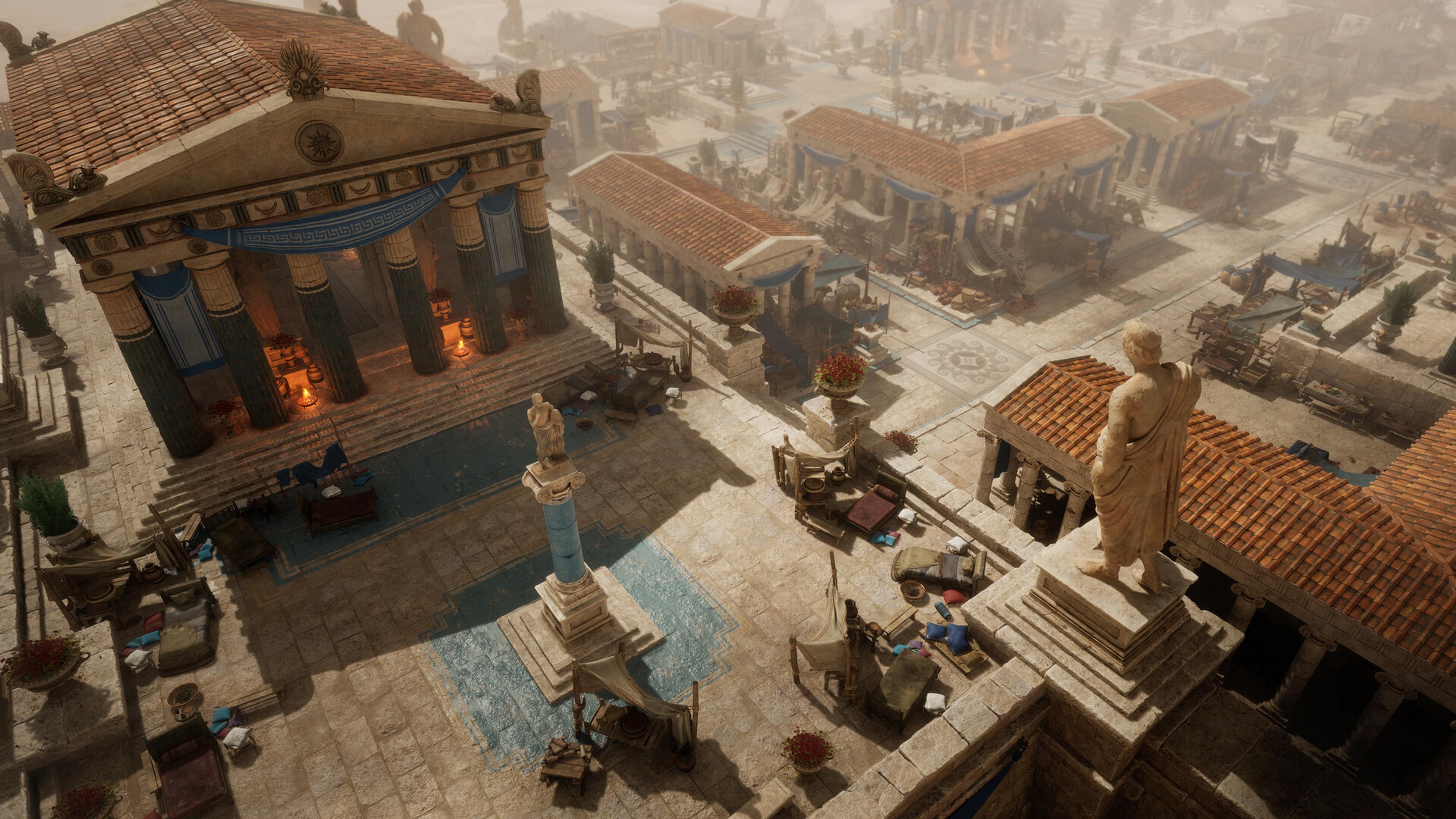 An aerial view of a Greek town in Titan Quest II, with temples, market stalls and statues