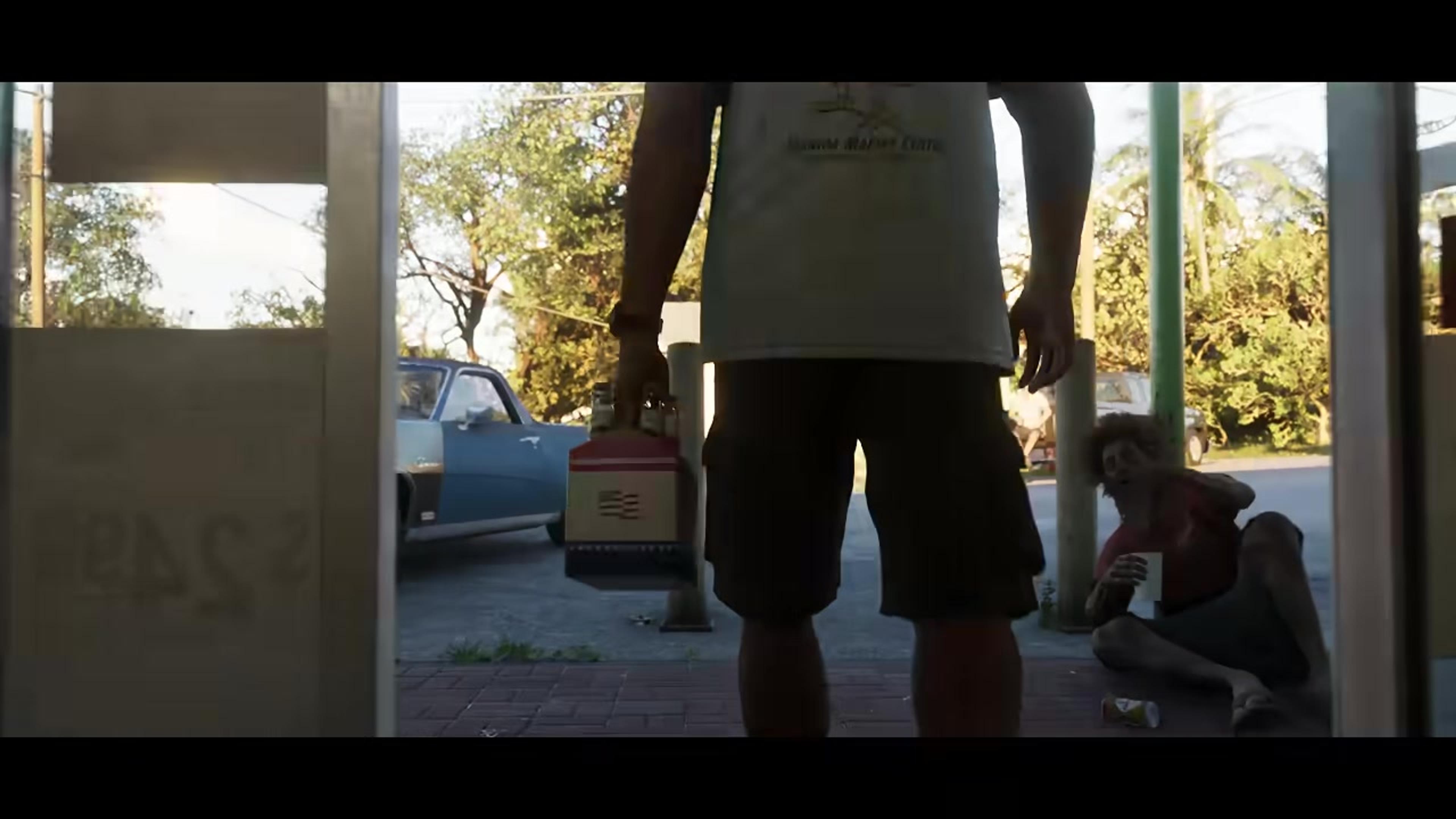 Two characters outside a run down storefront in Grand Theft Auto VI, one sitting on the ground