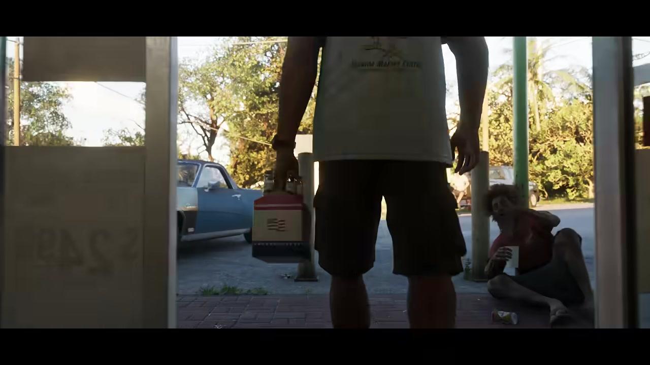 Two characters outside a run down storefront in Grand Theft Auto VI, one sitting on the ground
