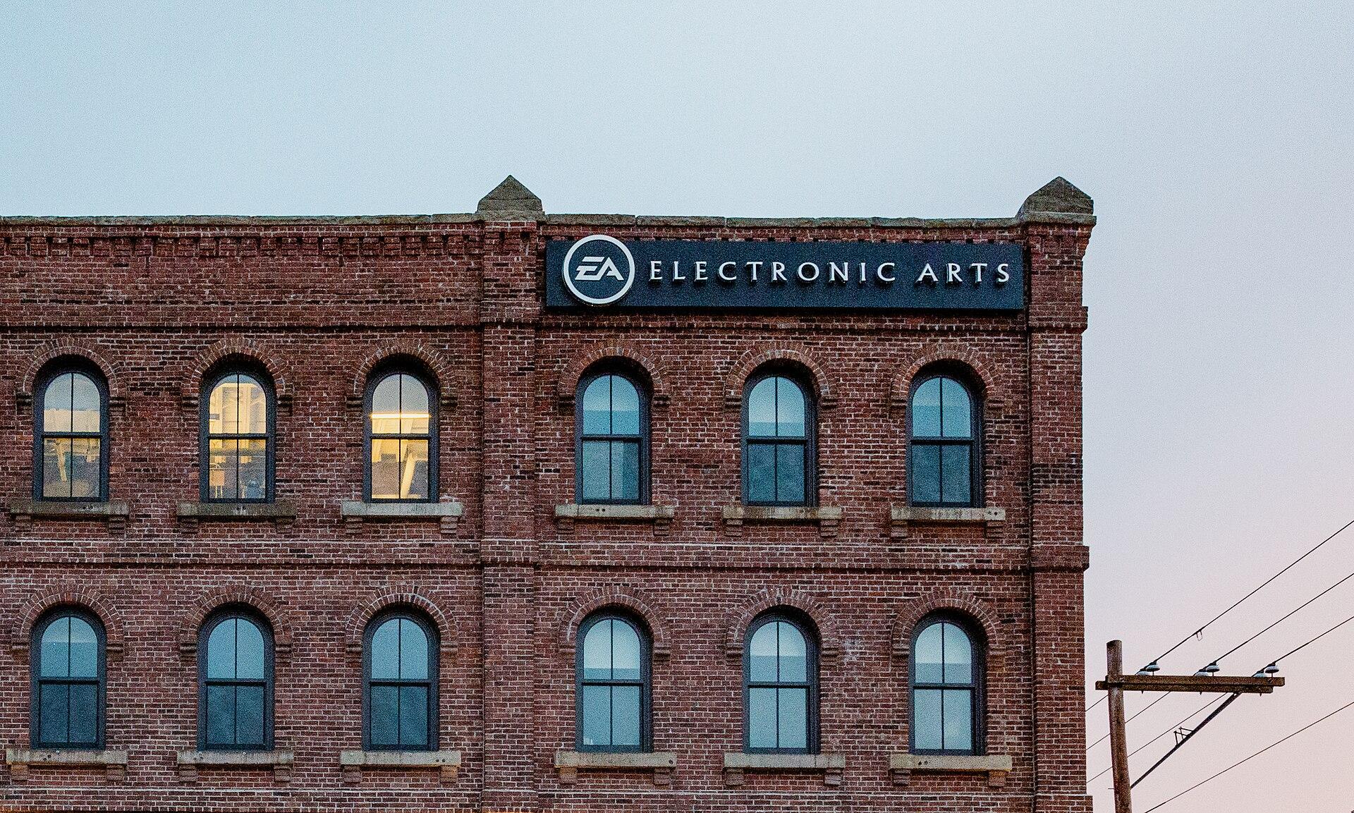 An Electronic Arts office building with the EA logo mounted on the brick facade