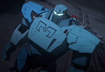 An armoured mech in white and blue standing in a hangar