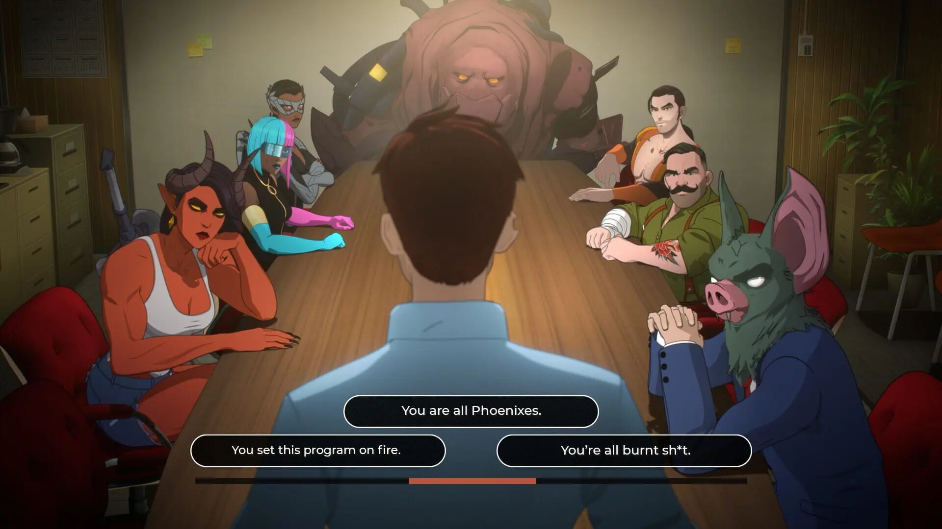 A man addressing a seated room of costumed characters in a briefing