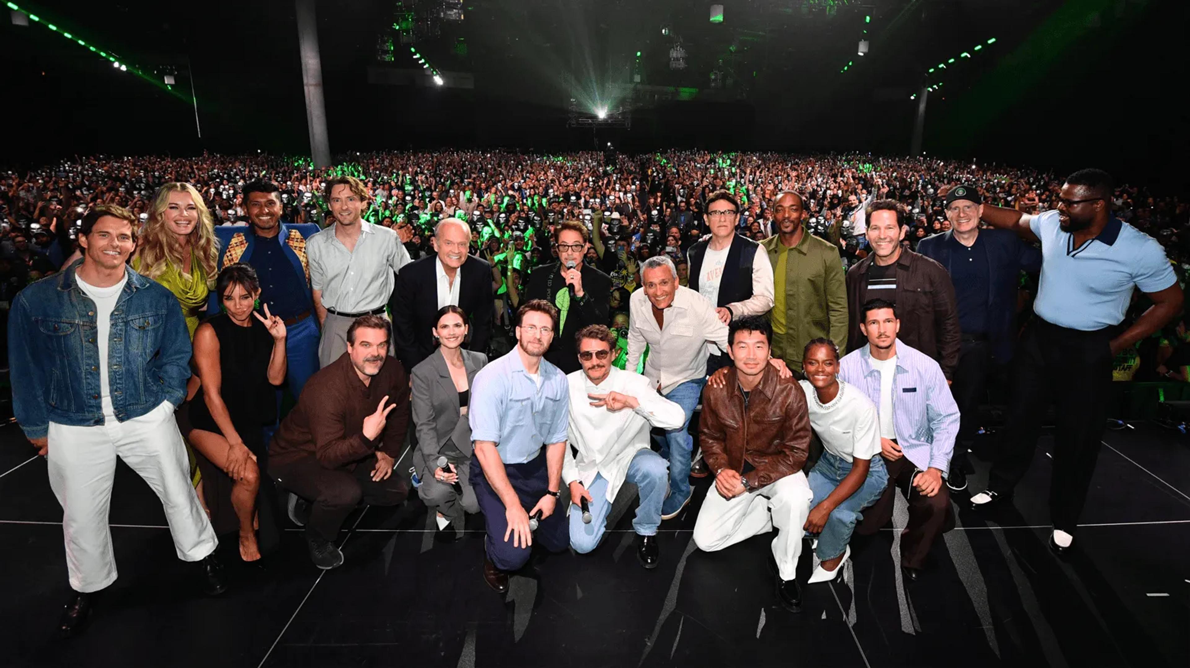 The Avengers: Doomsday cast and Kevin Feige posing on stage in front of the Hall H crowd at San Diego Comic-Con 2026. Photo via Marvel.