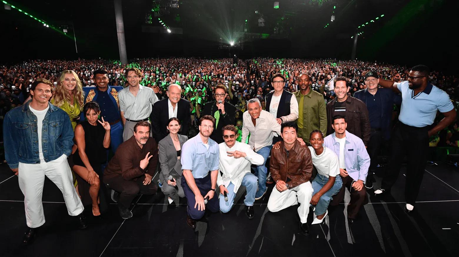 The Avengers: Doomsday cast and Kevin Feige posing on stage in front of the Hall H crowd at San Diego Comic-Con 2026. Photo via Marvel.
