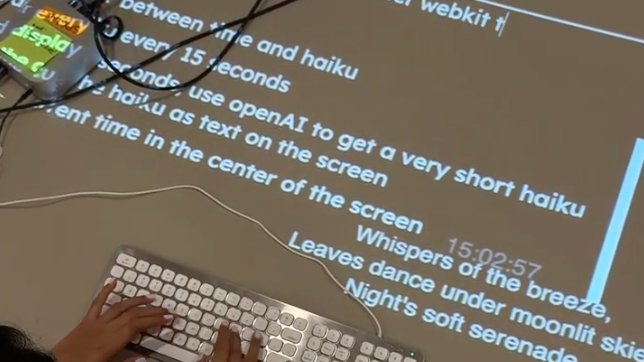 Student Naomi Shah programming the Spatial Pixel lab space.