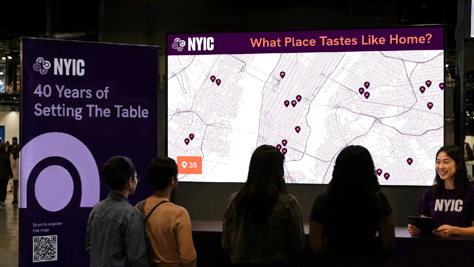 Several attendees stand in front of an interactive exhibition display featuring a large map titled "What Place Tastes Like Home?" while a presenter smiles and speaks from a booth. A nearby banner reads "NYIC: 40 Years of Setting the Table" with a QR code inviting visitors to explore the map, creating the atmosphere of a public exhibit or conference showcase.