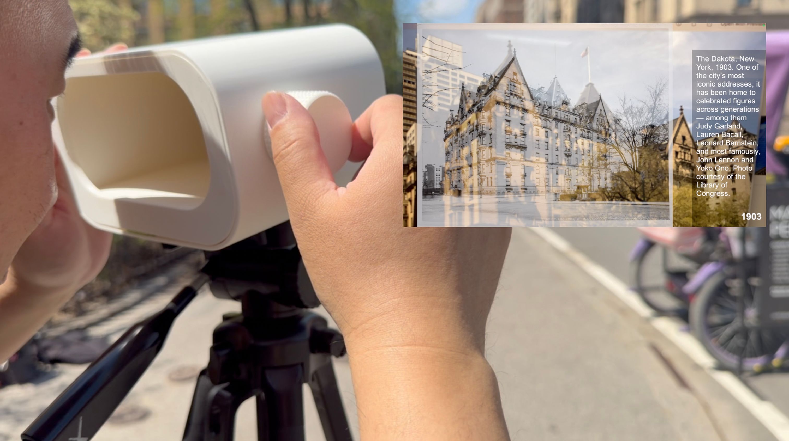 A man uses a viewfinder that superimposes an old photo of an NYC location over the location itself. 