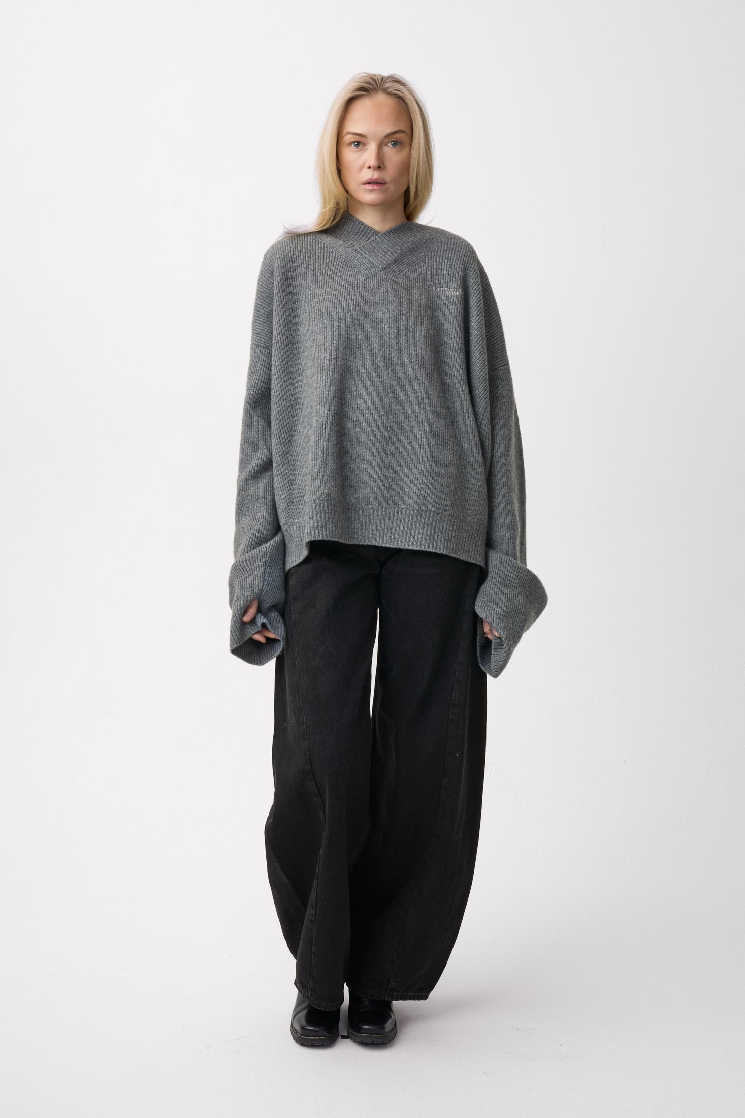 Model wearing Plateau Frame Oversized Sweater Grey Camo