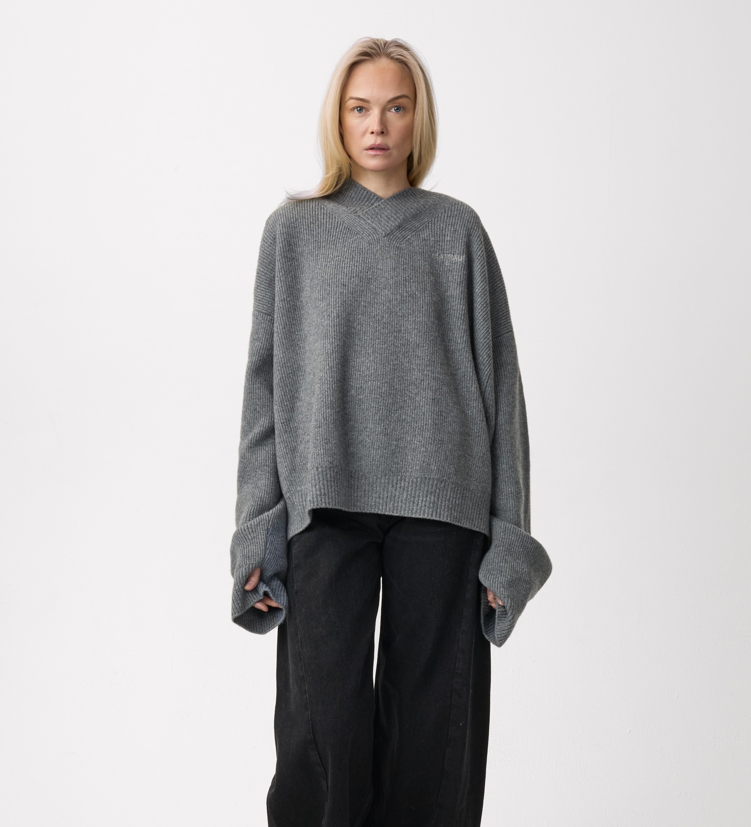 Model wearing Plateau Frame Oversized Sweater Grey Camo