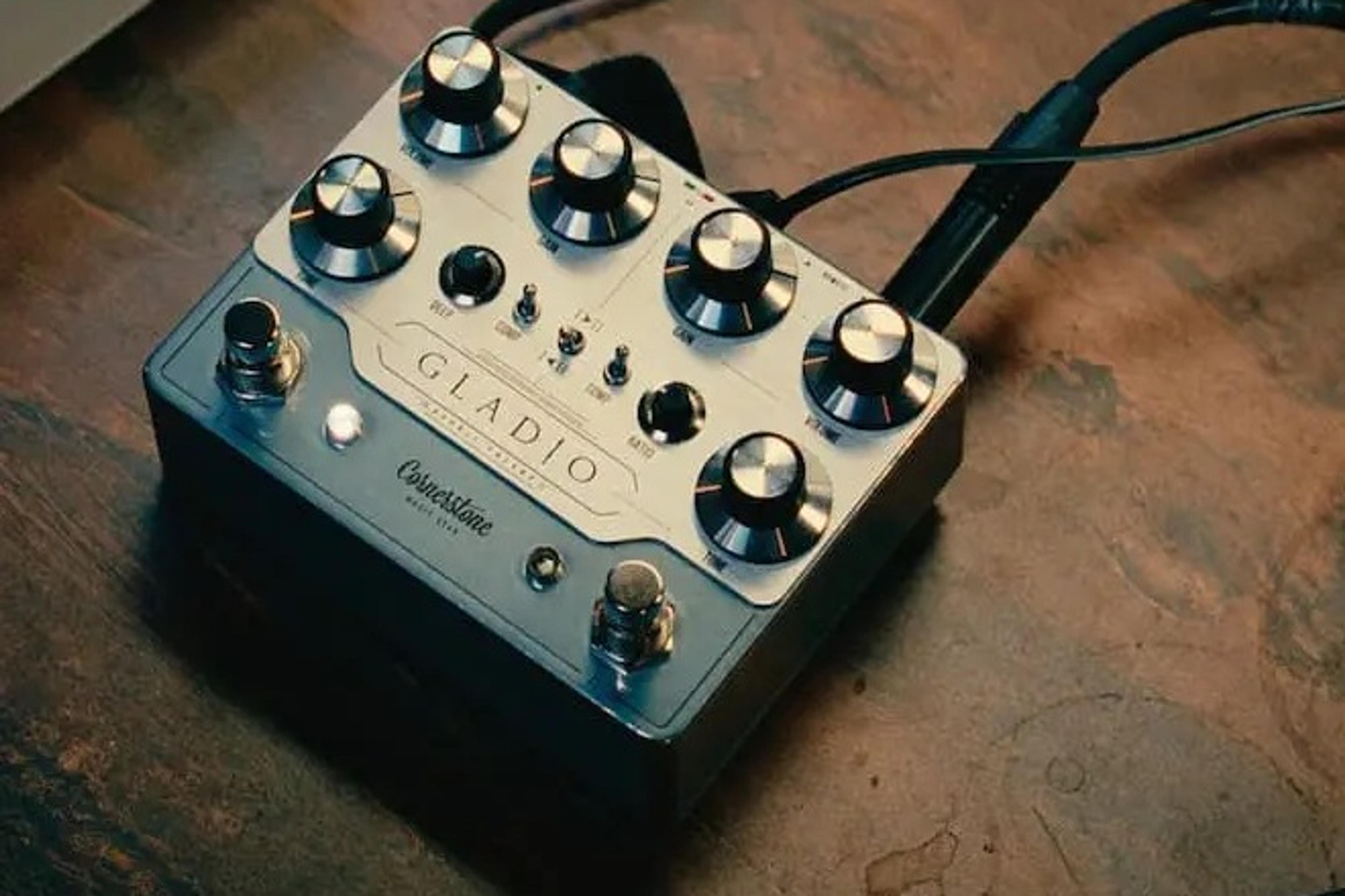 Cornerstone Gladio mk3 on a wooden desk with patch cables plugged in, Deep and Ratio knobs visible between the two channels