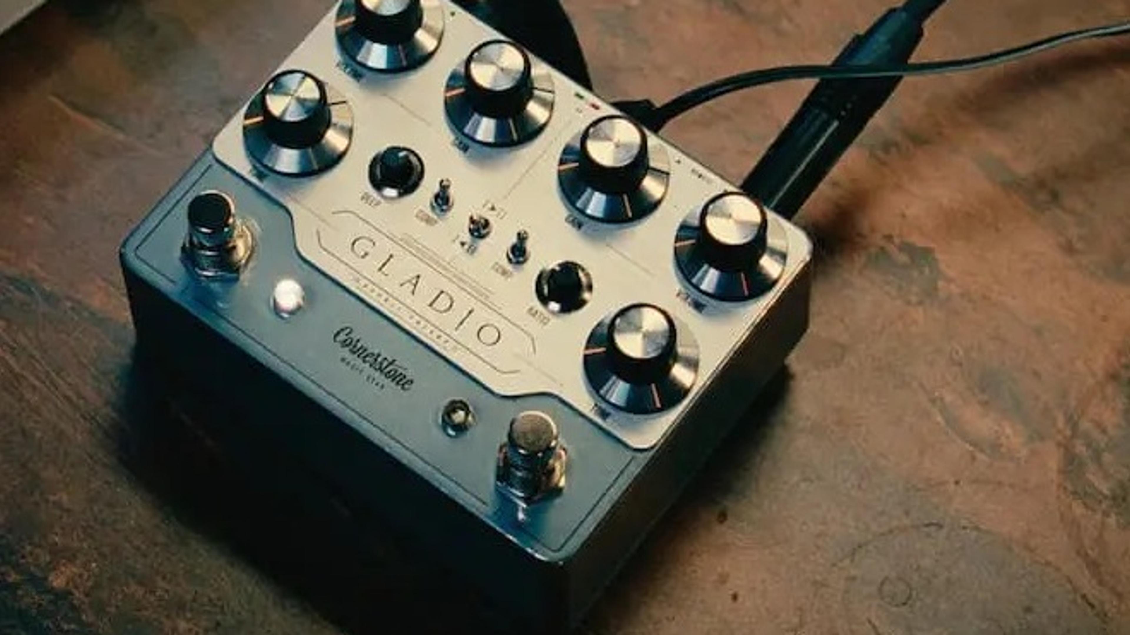 Cornerstone Gladio mk3 on a wooden desk with patch cables plugged in, Deep and Ratio knobs visible between the two channels