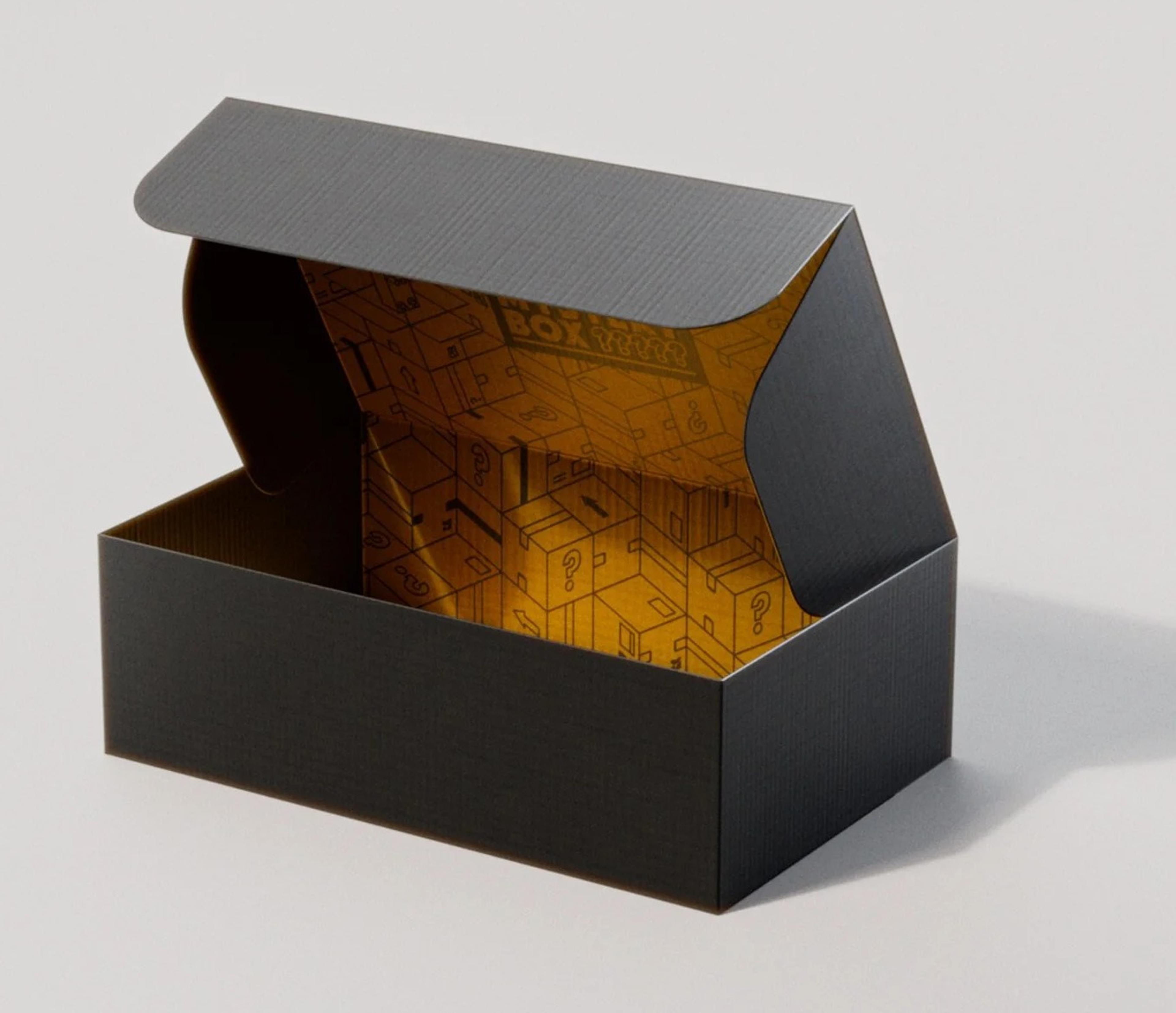 Empty black Chase Bliss Mystery Box with the lid open, showing a gold interior printed with question-mark boxes
