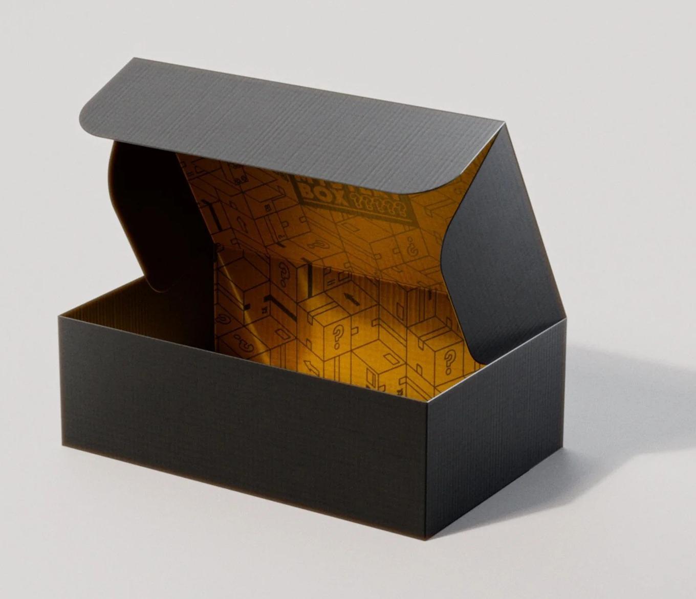 Empty black Chase Bliss Mystery Box with the lid open, showing a gold interior printed with question-mark boxes