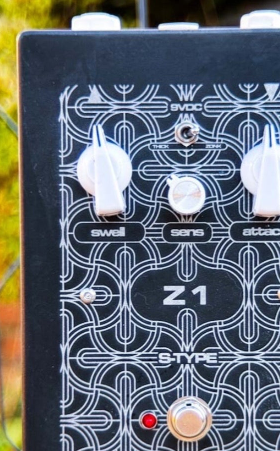 Reeves Electro Z1, front view, black acid-etched enclosure with Swell, Sens and Attack knobs, Thick/Zonk toggle and S-Type lettering