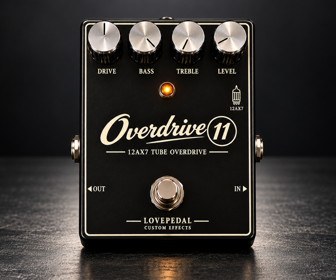 Lovepedal Overdrive 11, front view, black enclosure with Drive, Bass, Treble and Level knobs, a footswitch and 12AX7 tube overdrive lettering