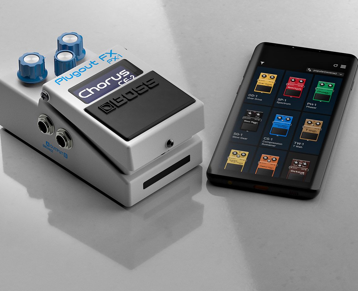 BOSS PX-1 Plugout FX showing CE-2 Chorus on its display, lying beside a smartphone with a grid of BOSS compact pedal models on screen