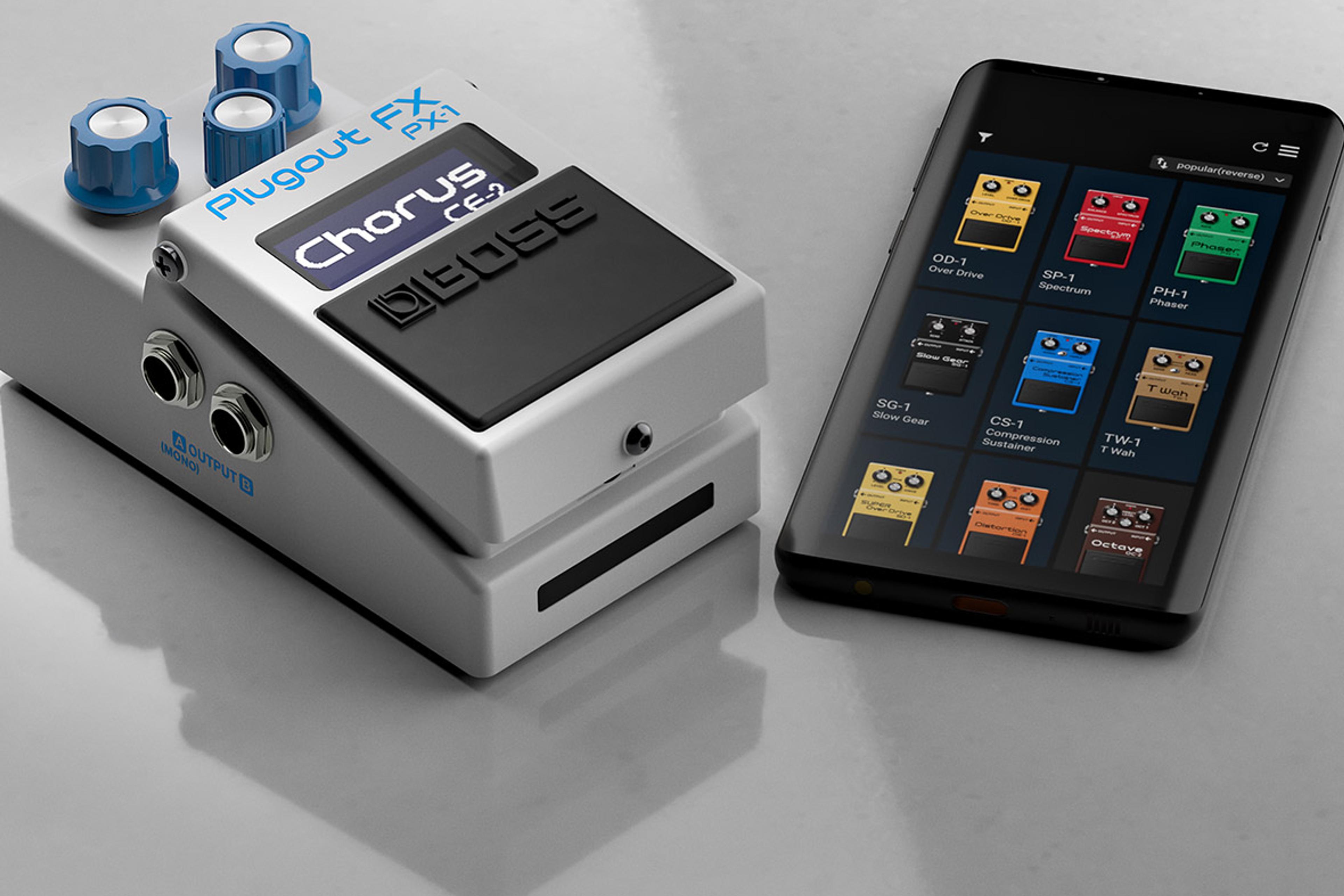 BOSS PX-1 Plugout FX showing CE-2 Chorus on its display, lying beside a smartphone with a grid of BOSS compact pedal models on screen