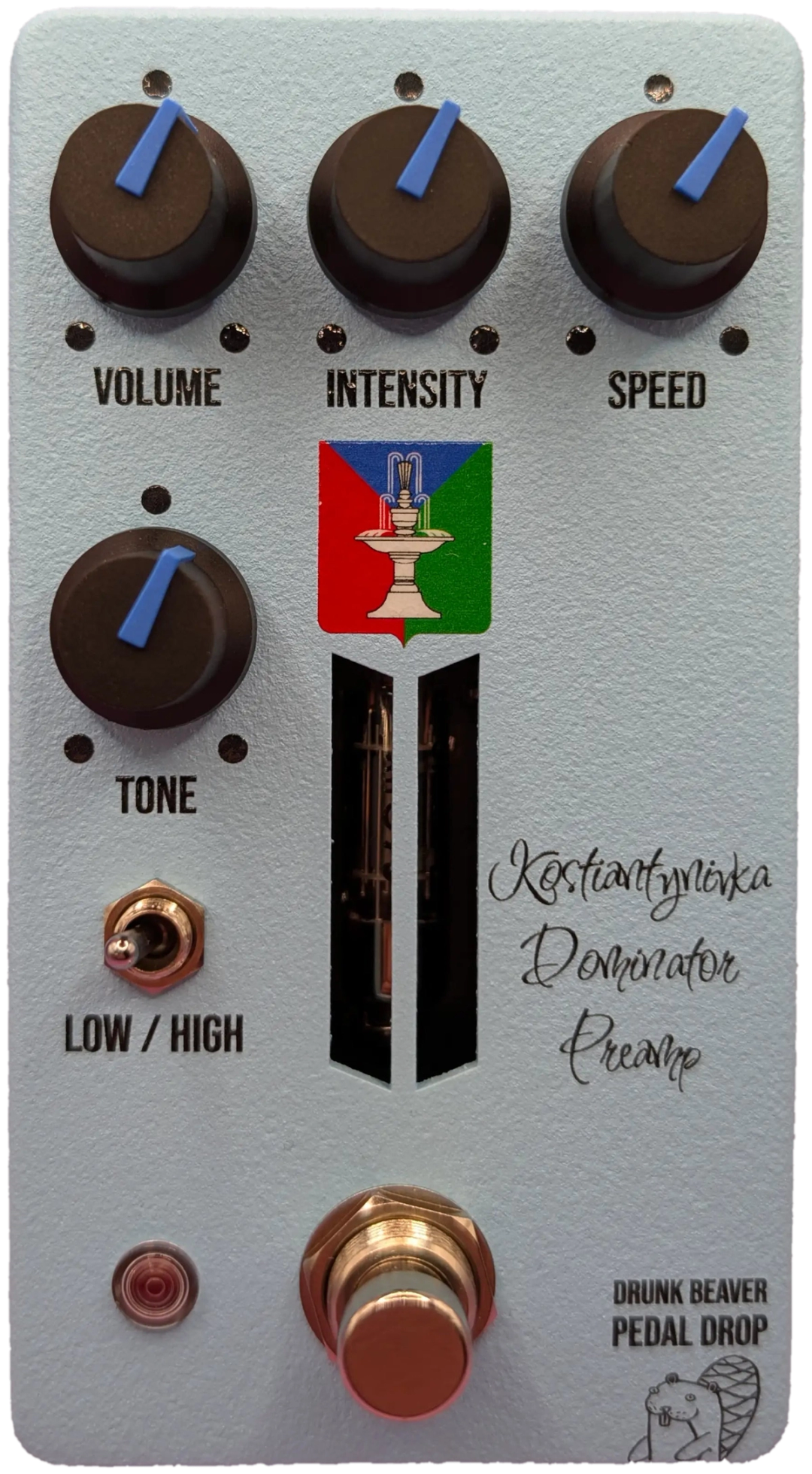 Drunk Beaver Kostiantynivka Dominator Preamp, top-down, pale blue enclosure, four black knobs with blue pointers, Low/High toggle, copper footswitch