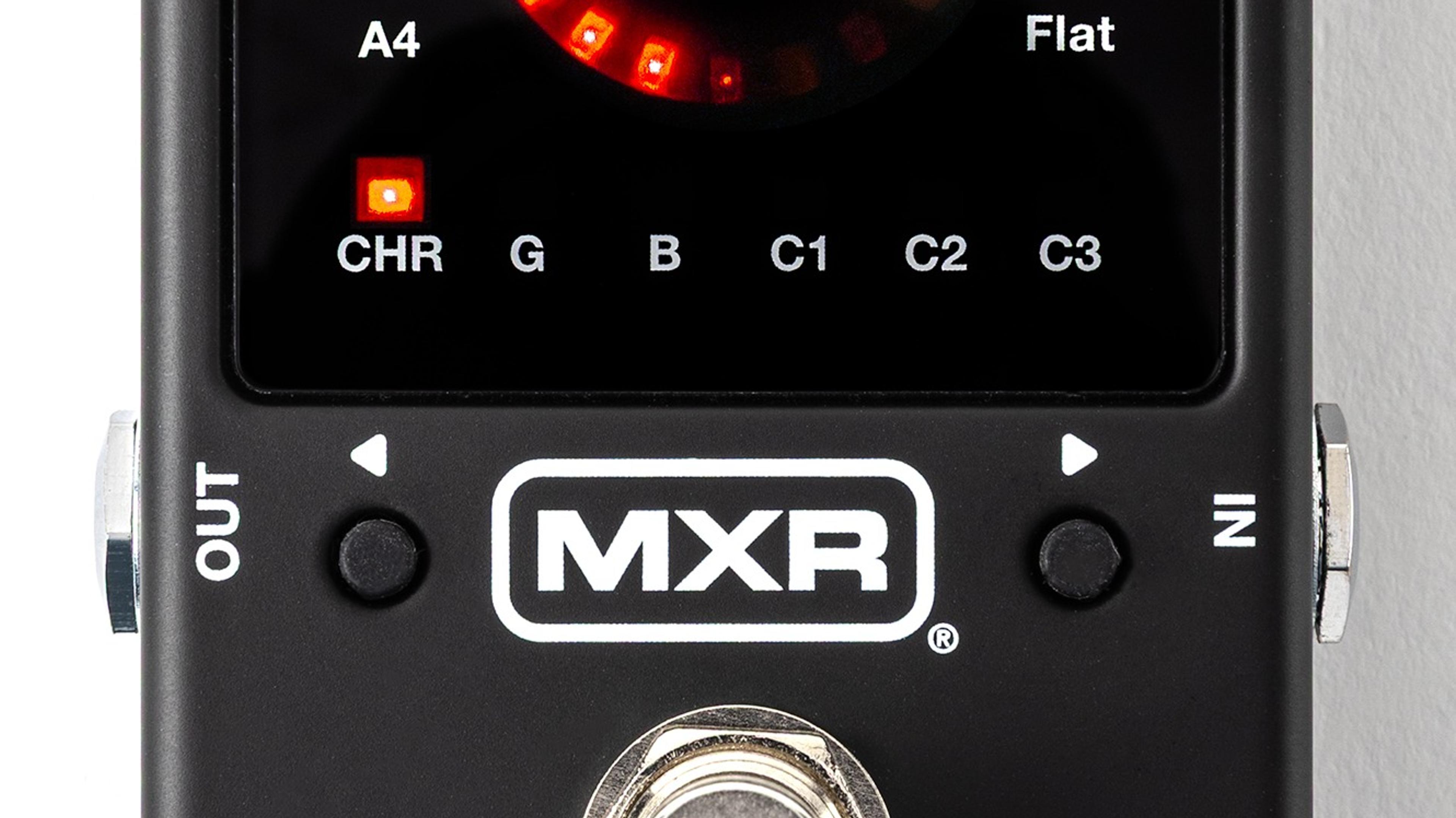 MXR Turbo Tuner M400 from above on white, black enclosure with the red strobe ring and note display lit, MXR badge over a chrome footswitch