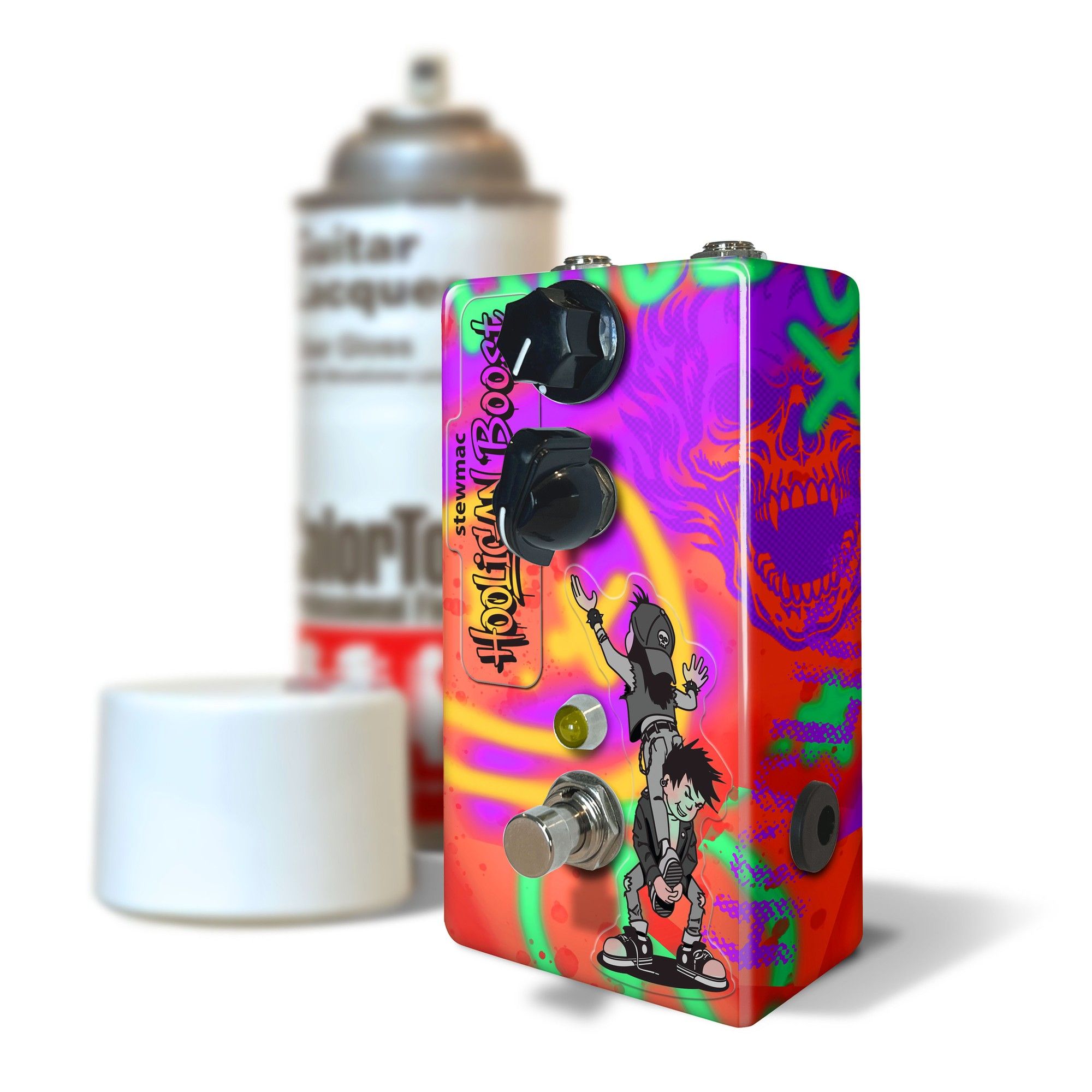StewMac Hooligan Boost custom-painted enclosure next to a ColorTone spray can, graffiti graphics and skull side art