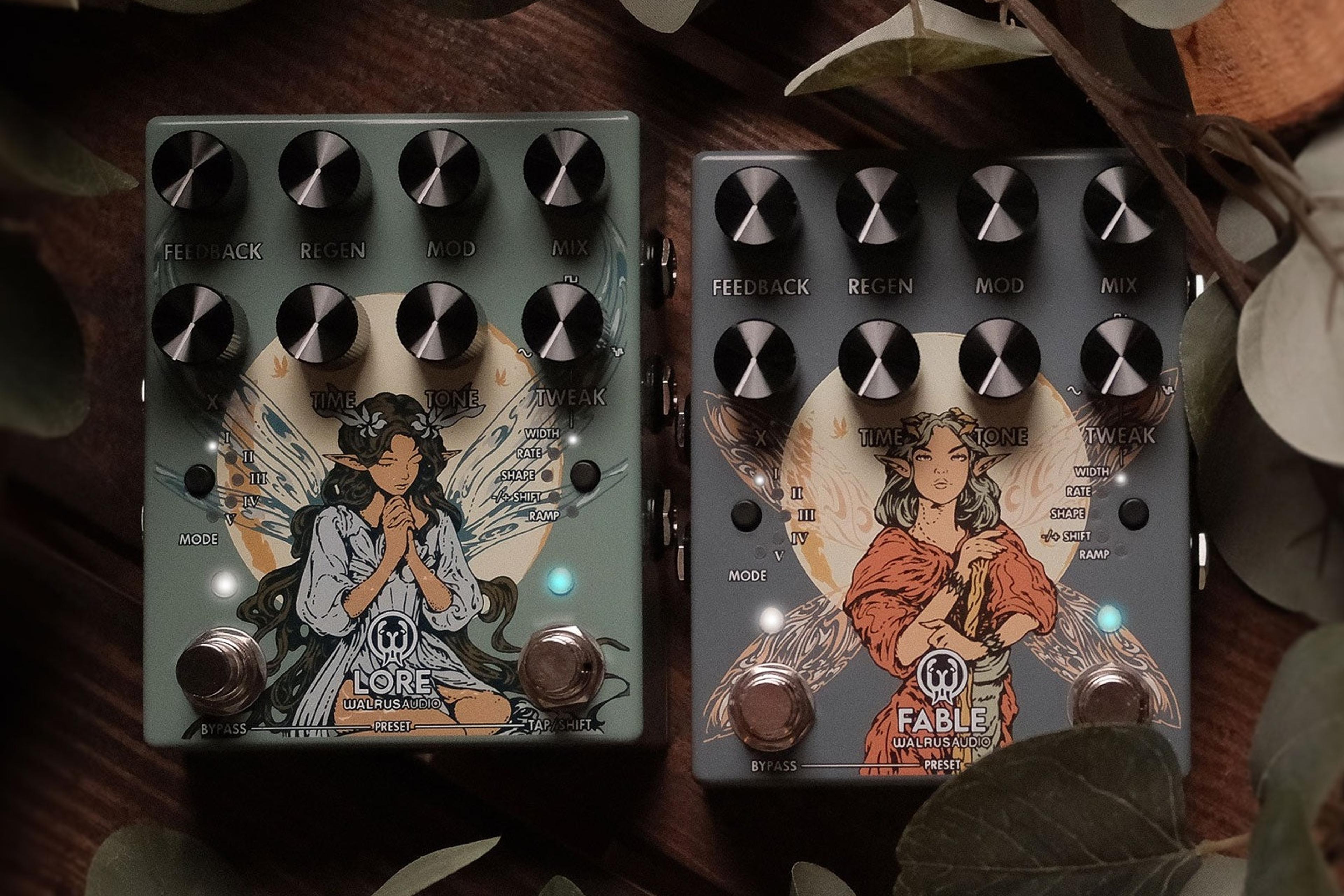 Walrus Audio Lore MKII in sage green and Fable MKII in slate grey side by side on a dark wooden table among eucalyptus leaves and old books