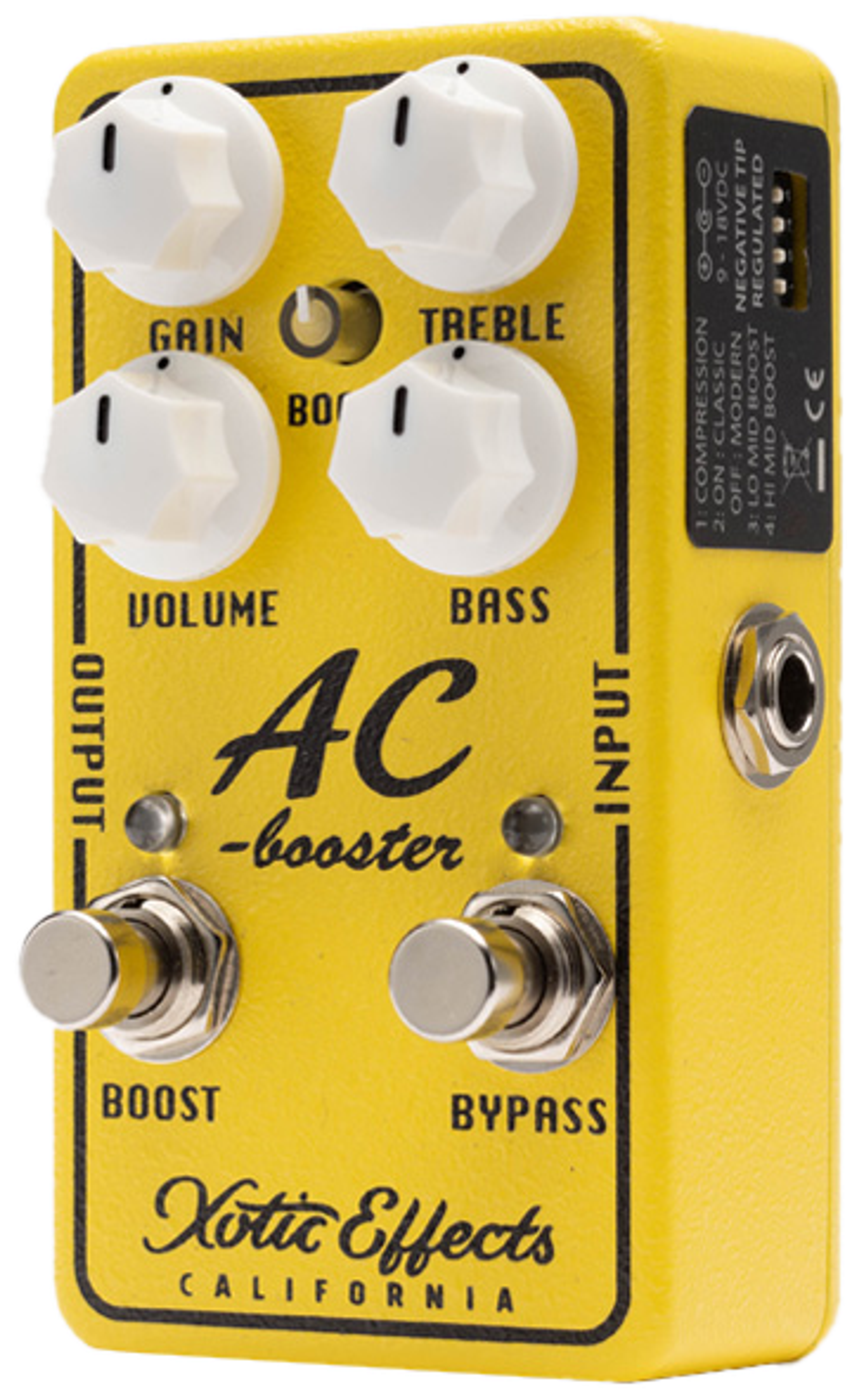 Xotic AC Booster V2, three-quarter view, yellow enclosure, white knobs, Boost and Bypass footswitches