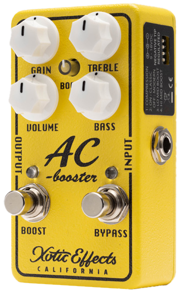 Xotic AC Booster V2, three-quarter view, yellow enclosure, white knobs, Boost and Bypass footswitches