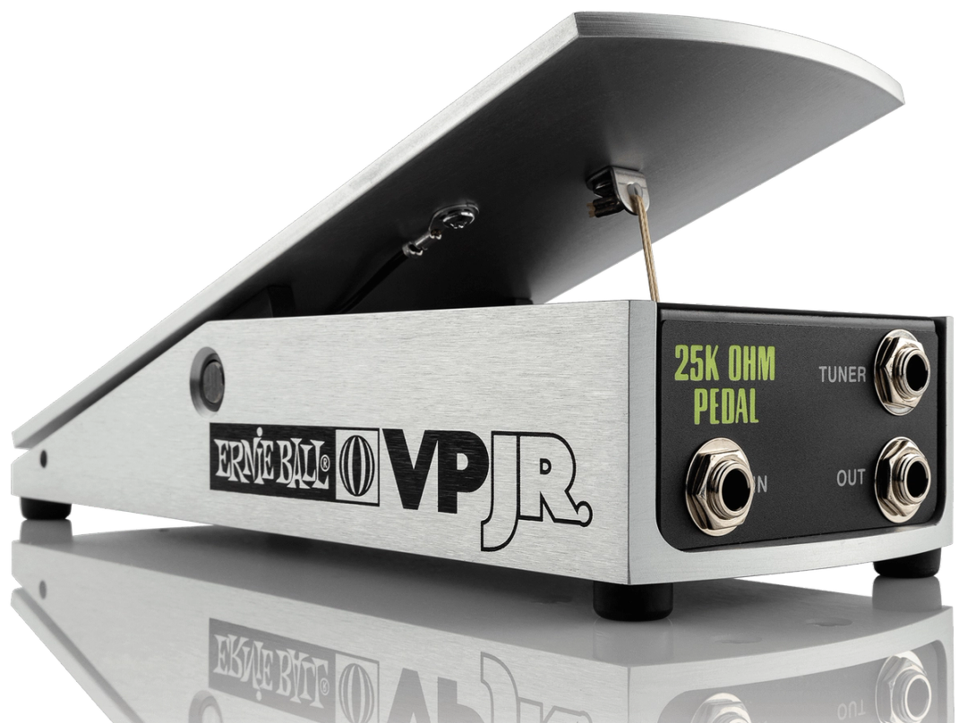 Ernie Ball VP Jr 25K volume pedal, three-quarter view, brushed aluminium treadle, IN OUT TUNER jacks