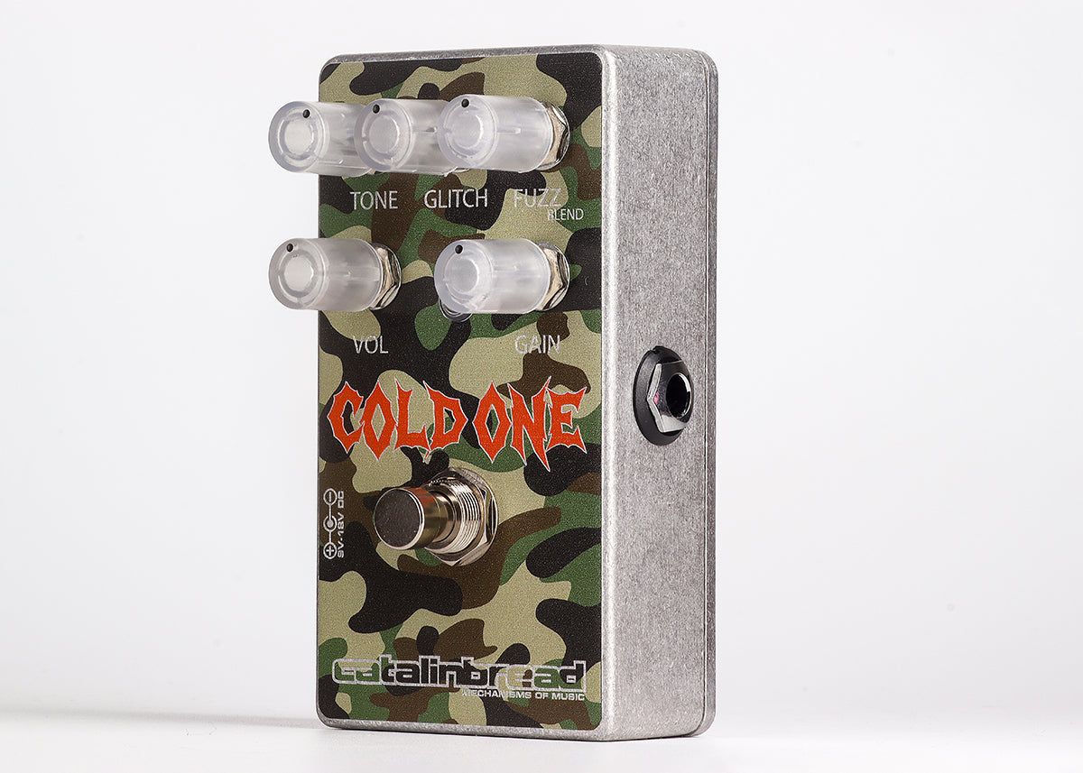 Catalinbread Cold One at an angle on a light grey background, green camouflage enclosure with five clear knobs and orange Cold One logo