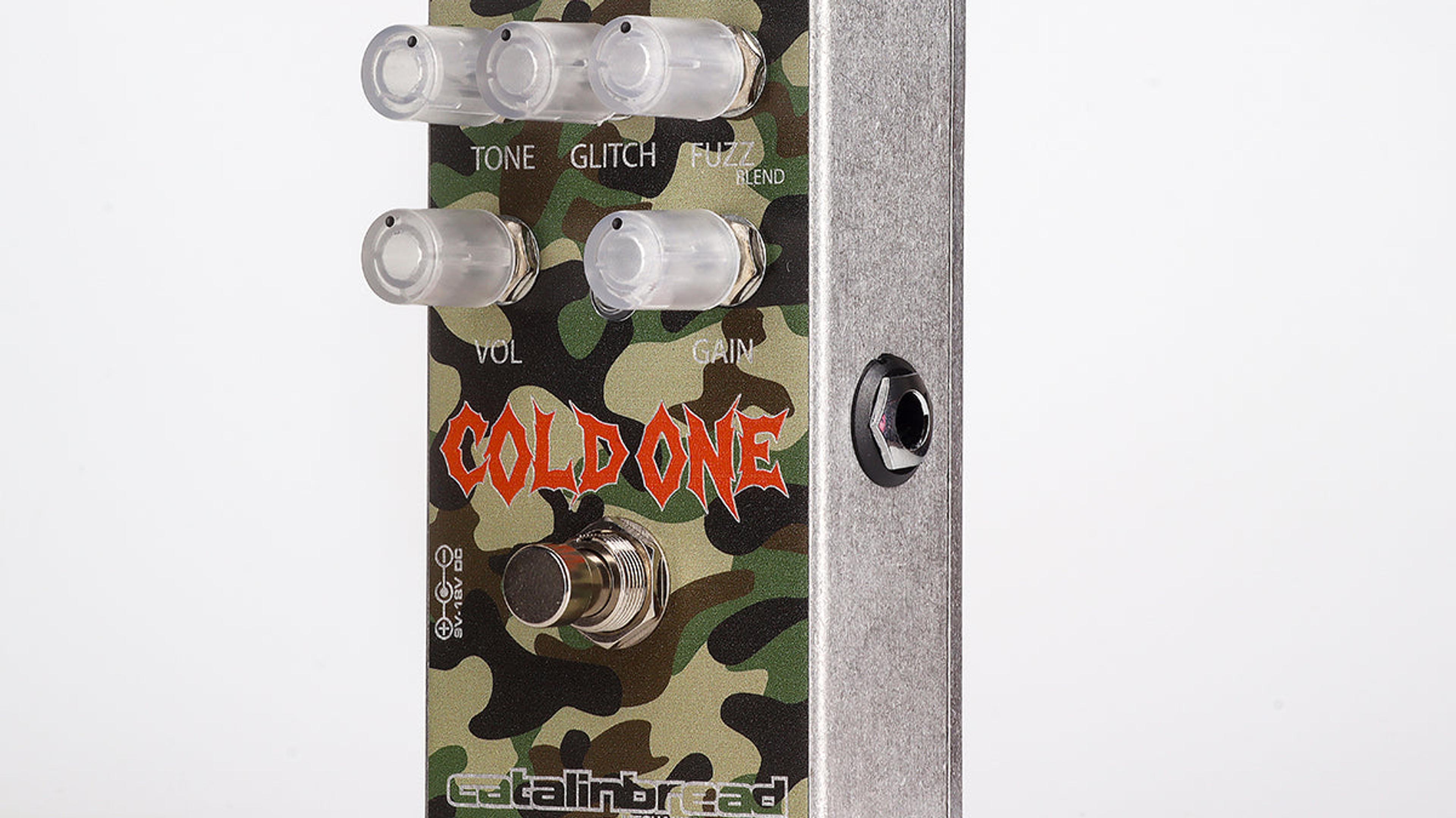 Catalinbread Cold One at an angle on a light grey background, green camouflage enclosure with five clear knobs and orange Cold One logo