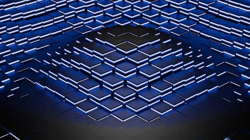 Intricate blue geometric 3D pattern with lighting effects creating a modern abstract design.