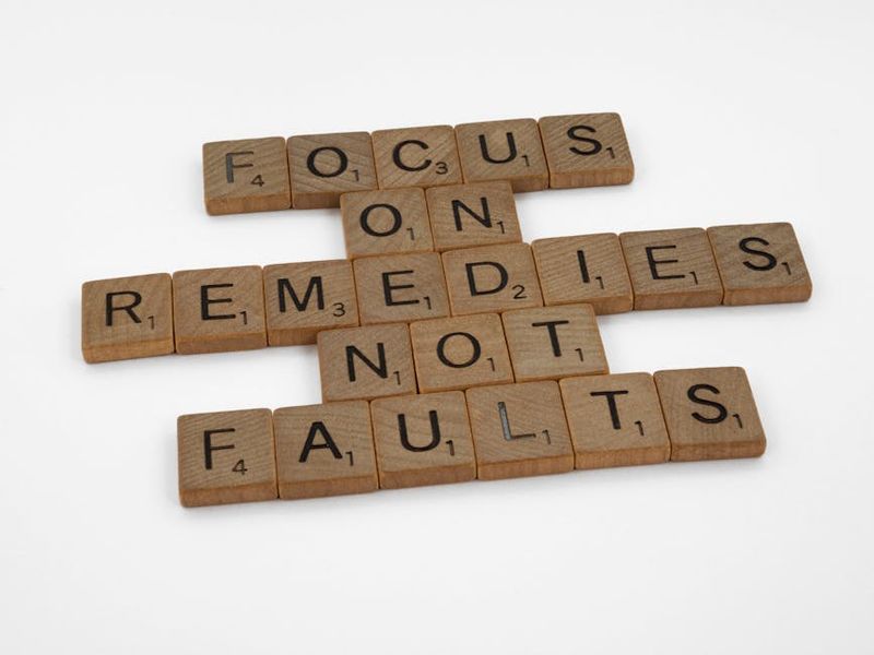 Scrabble tiles spelling an inspirational message on focus and problem-solving.