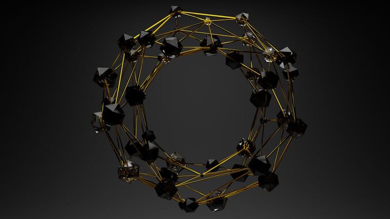 3D abstract geometric structure with gold lines and black polygons on a dark background.