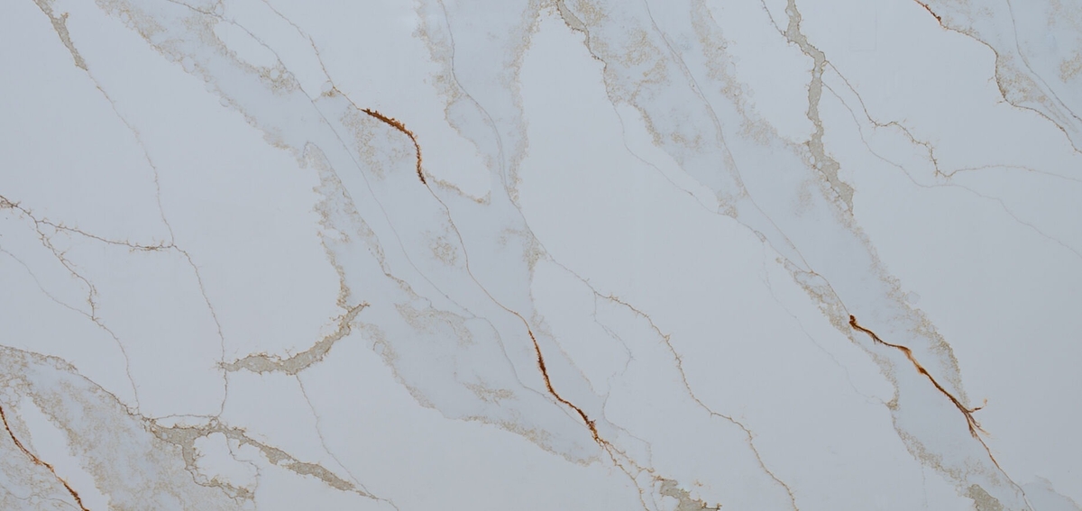 Moon Valley Quartz takes inspiration from Macchia Vecchia Calacatta marble, showcasing a crisp white background enhanced by bold, dynamic veining in rich shades of brown and rust.