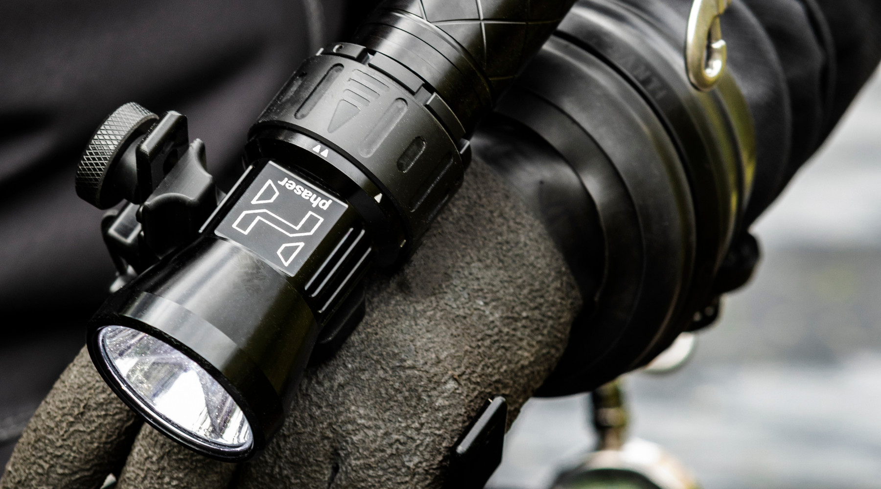 Close-up of Halcyon Phaser primary dive light mounted on a diver's hand